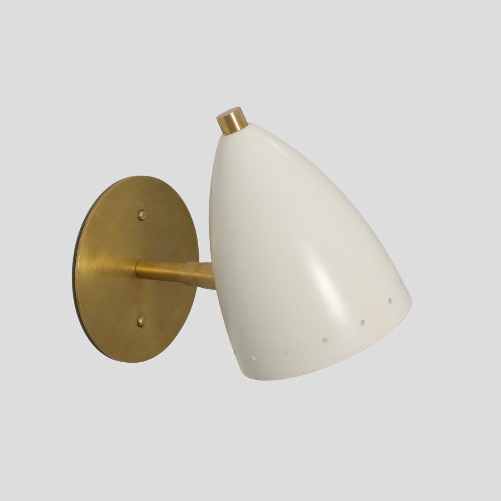 Bullet shade wall light in raw brass, minimalist mid-century design