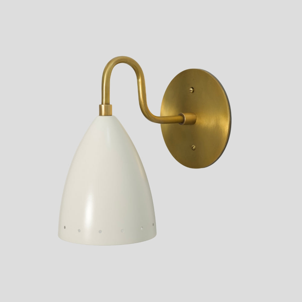 Modern brass wall sconce with matte white perforated shade, mid-century wall light for hallway or bedroom.