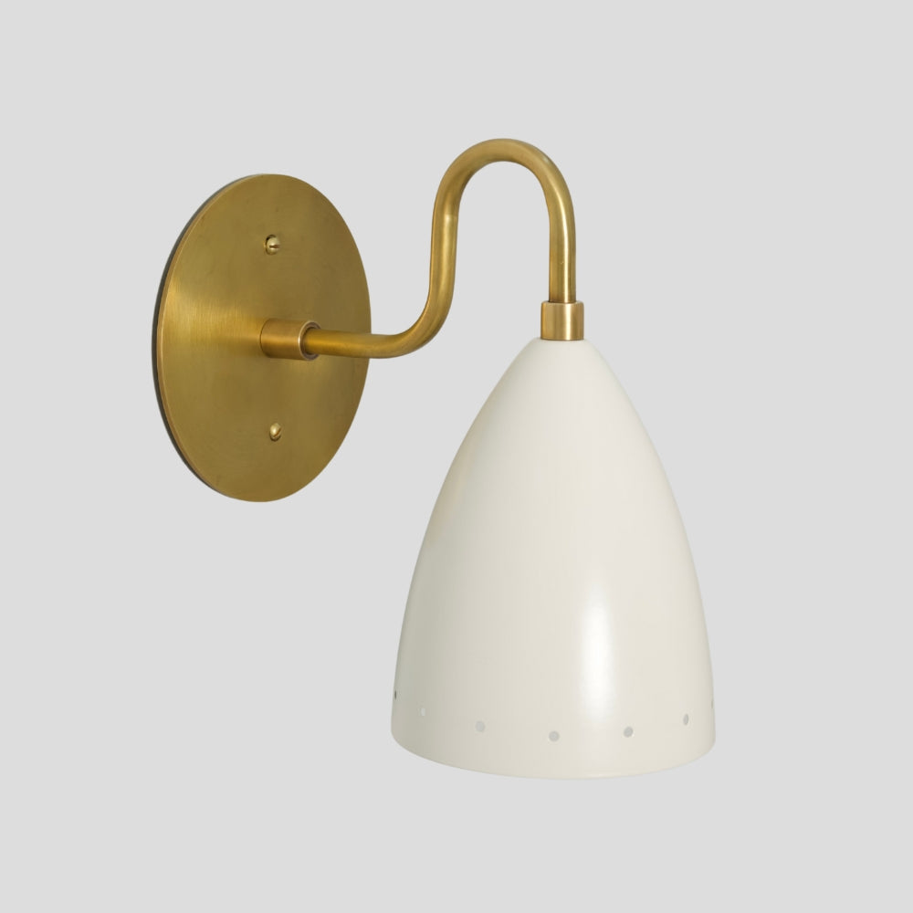 Solid brass modern wall sconce with perforated white shade, mid-century inspired accent light.