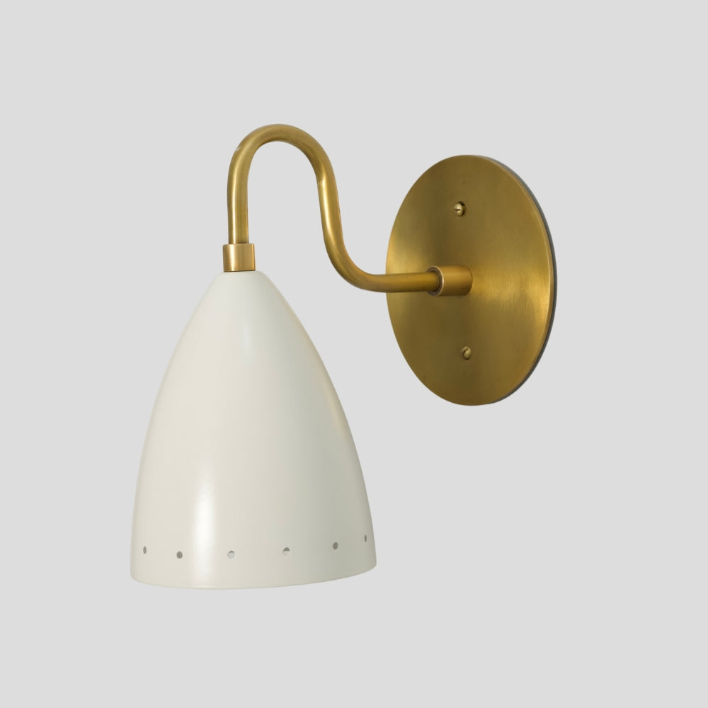 Modern brass wall sconce with matte white perforated shade, mid-century wall light for hallway or bedroom.