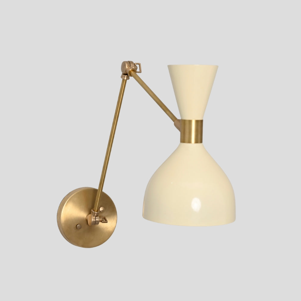 Cream hourglass shade sconce with pivoting brass arm for reading light