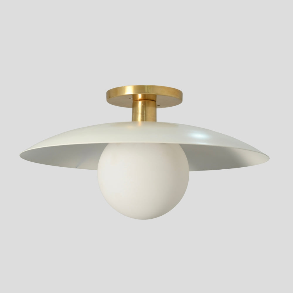 Flush mount ceiling light featuring a smooth, spherical glass globe with a matte white finish, designed for a clean and minimalist look.