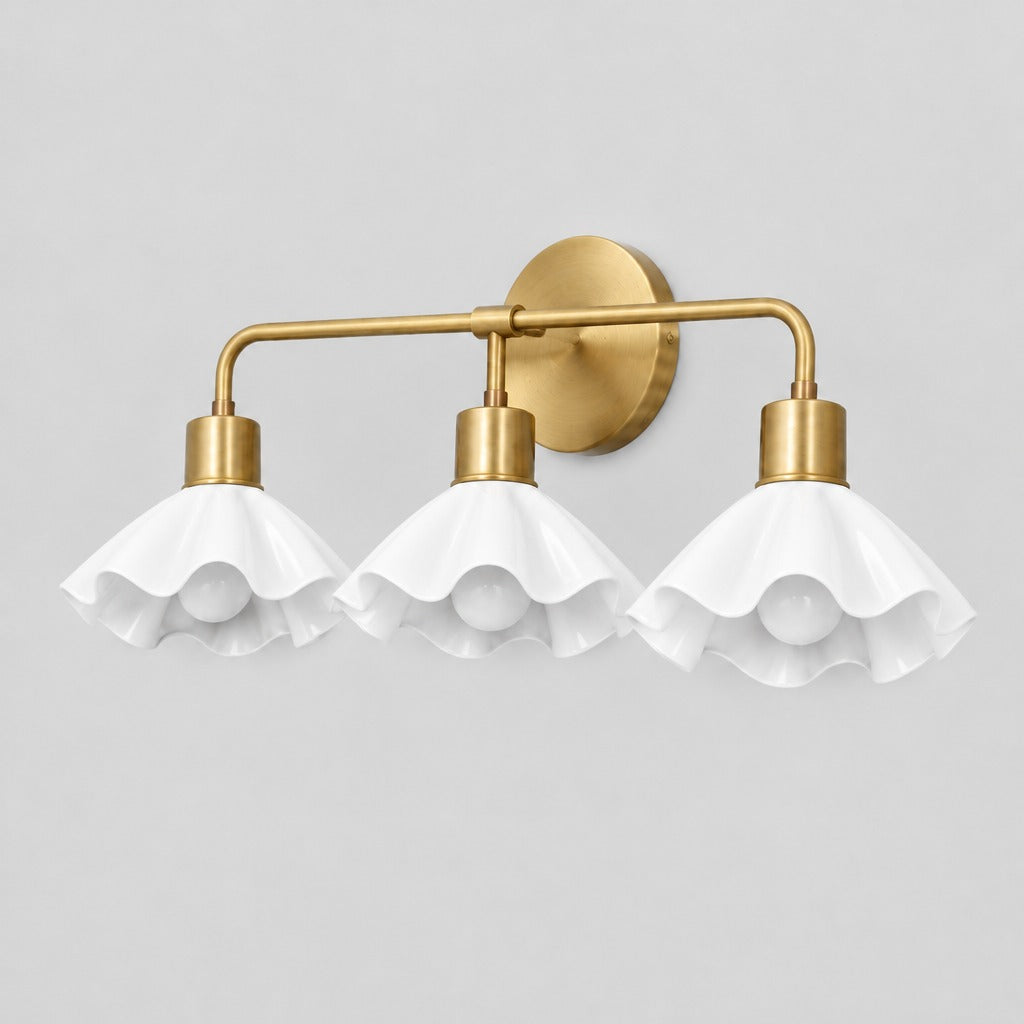 Triple Flower Wall Sconce, three-quarter view from the right, solid brass vanity light by BrassBeam