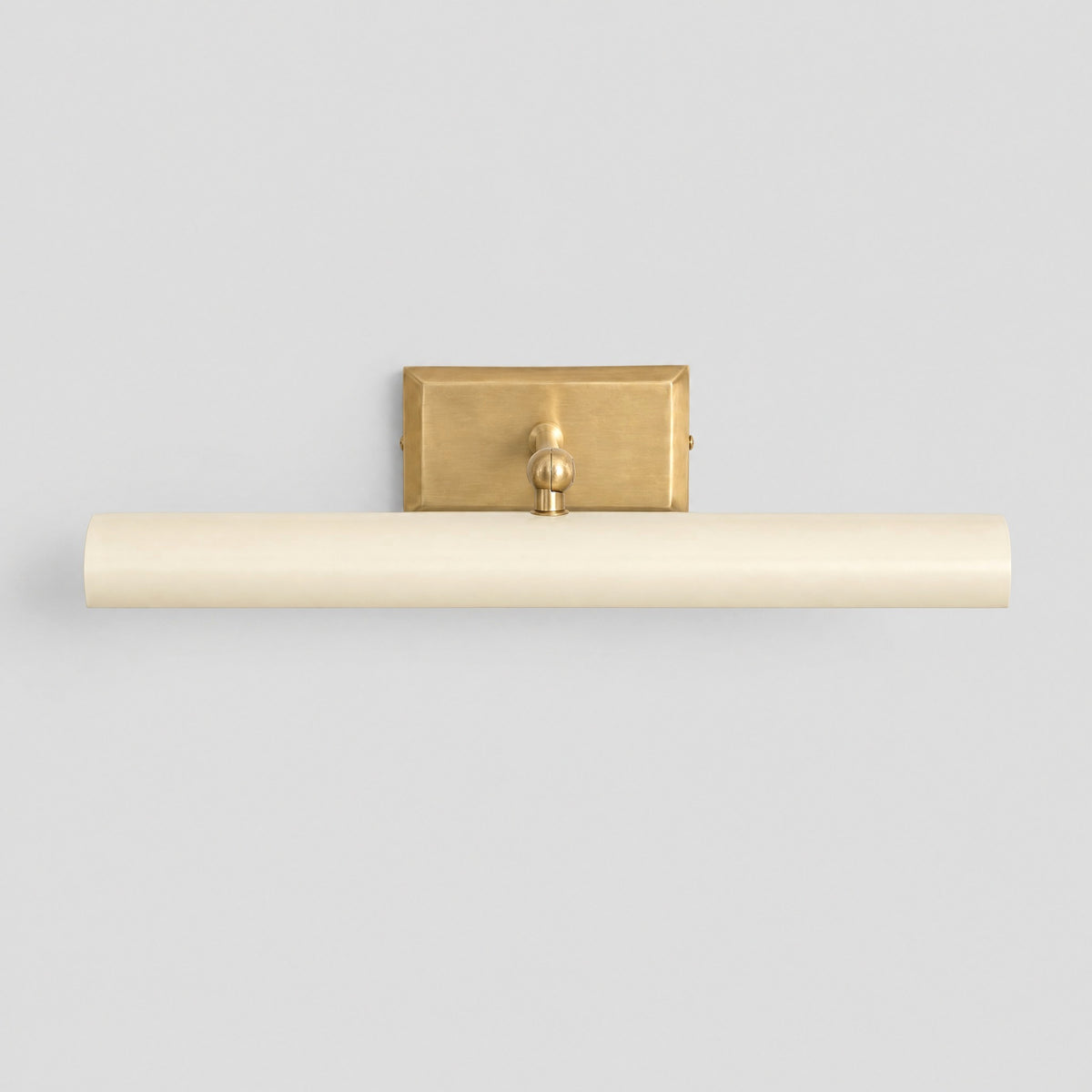 Picture light with cream shade and solid brass backplate and arm, front view, by BrassBeam