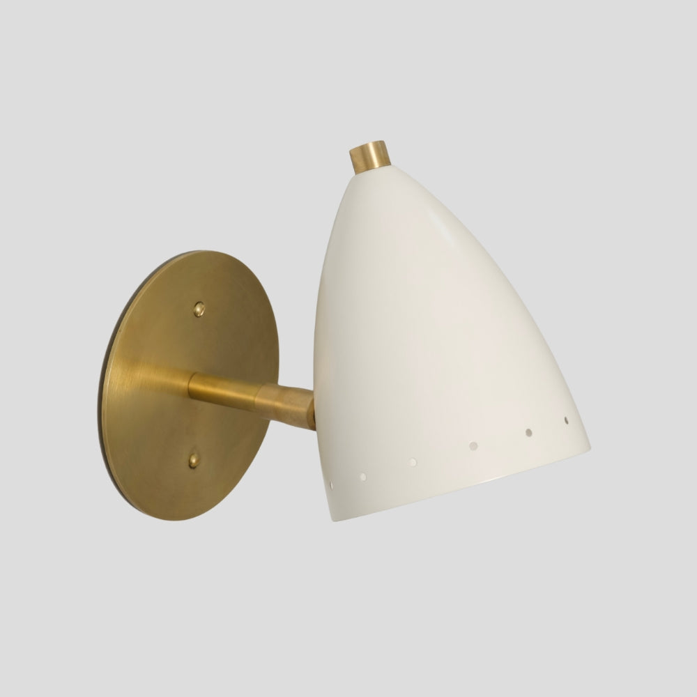 Small bedside brass wall sconce with matte white bullet-shaped shade