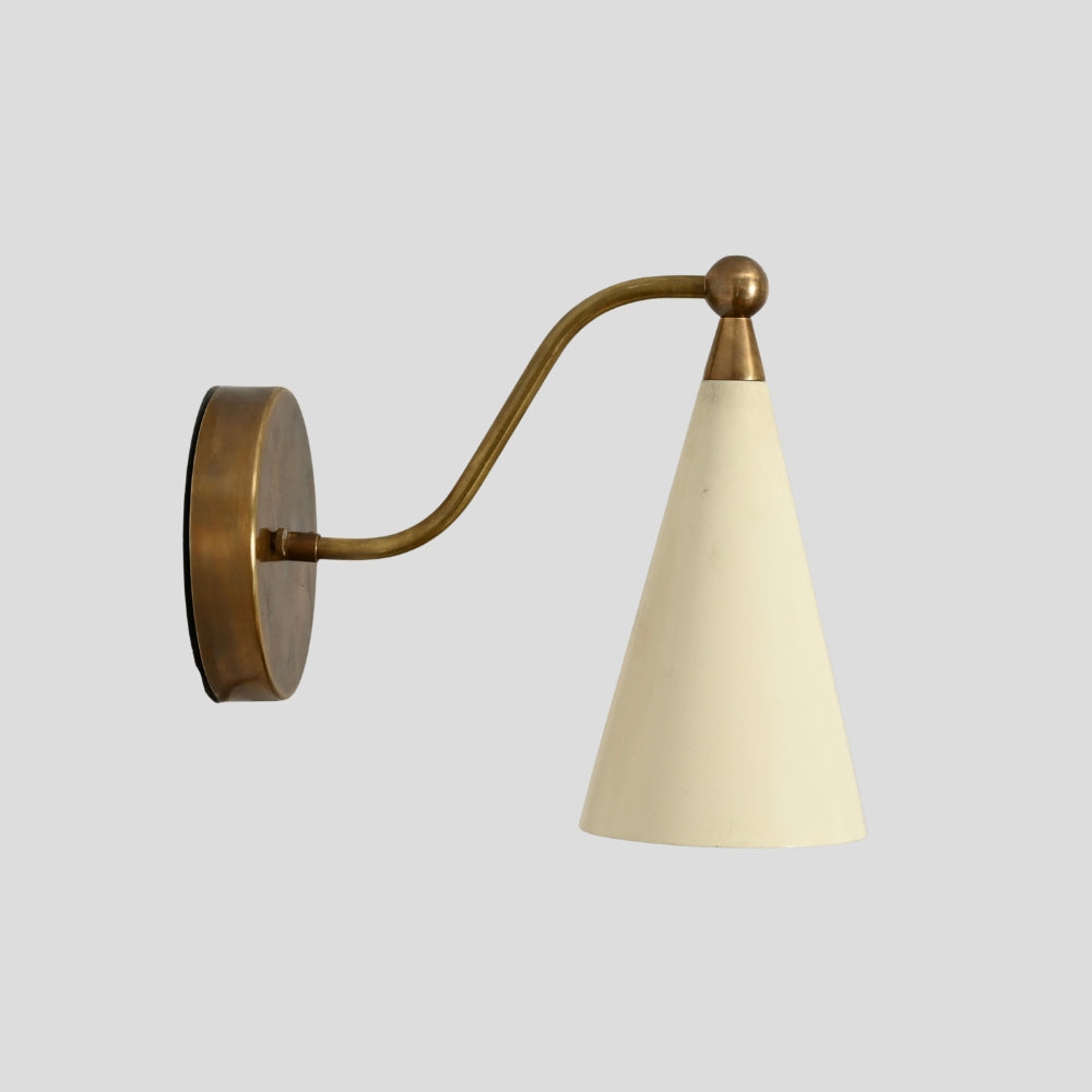 Mid century brass wall light with cream cone shade for hallway or bedside lighting.