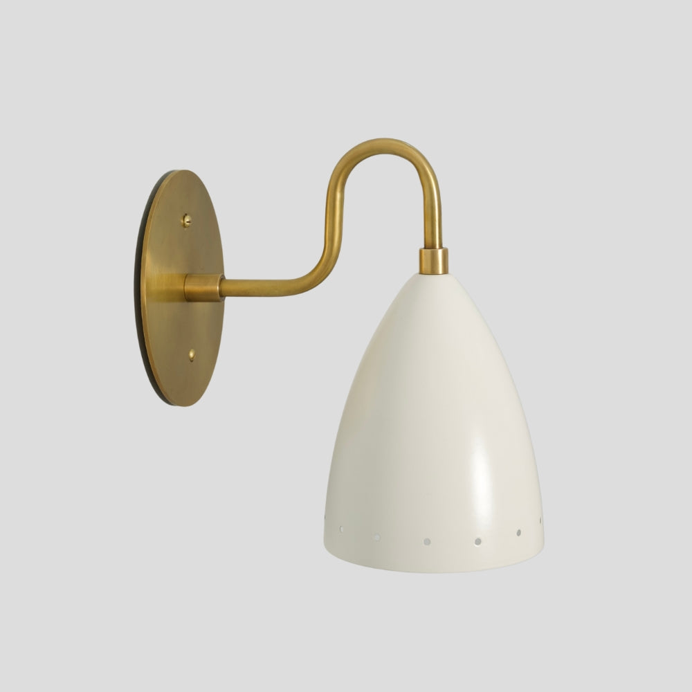 Wall-mounted lamp with brass arm and white shade.