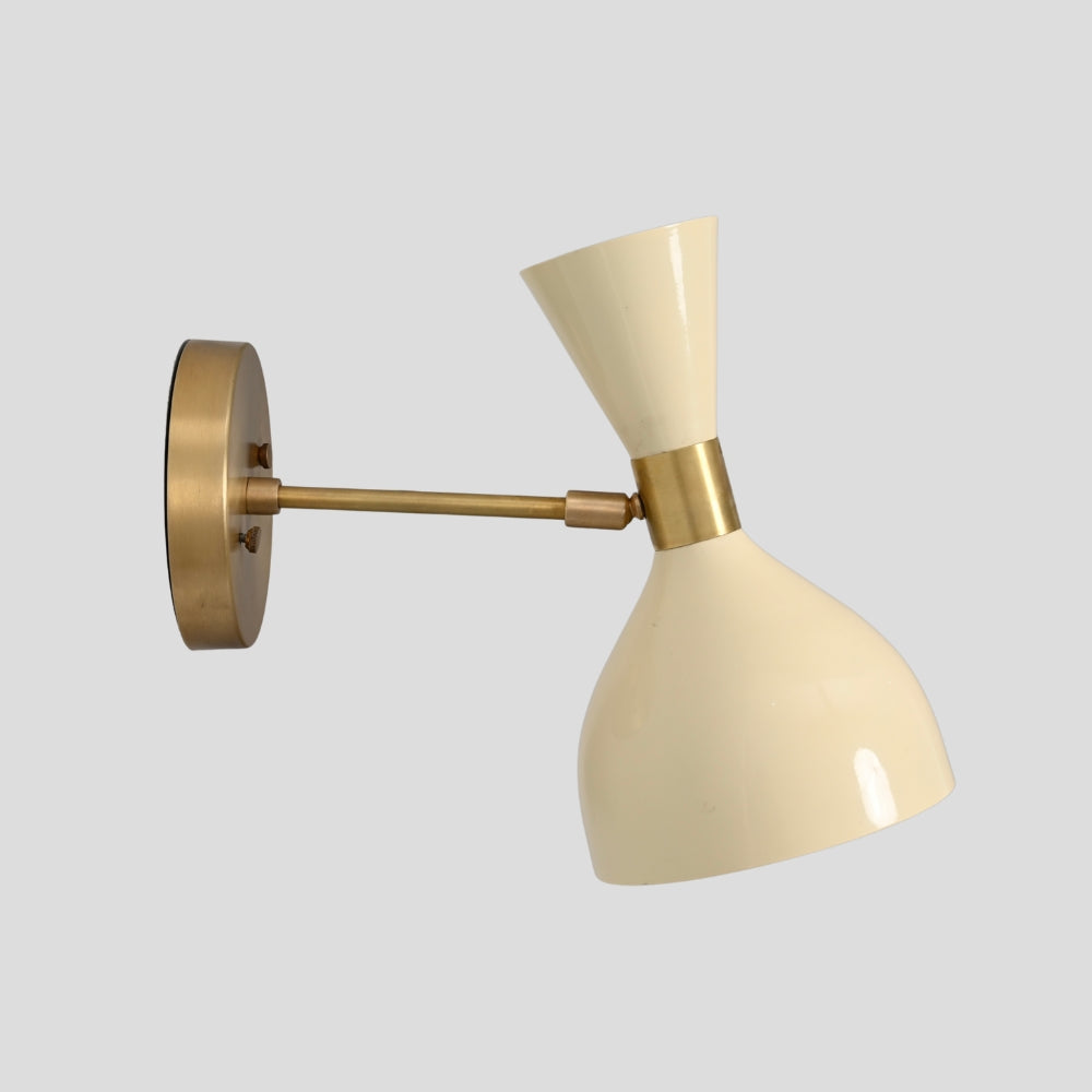 Handcrafted brass sconce wall light with cream double-cone shade close up