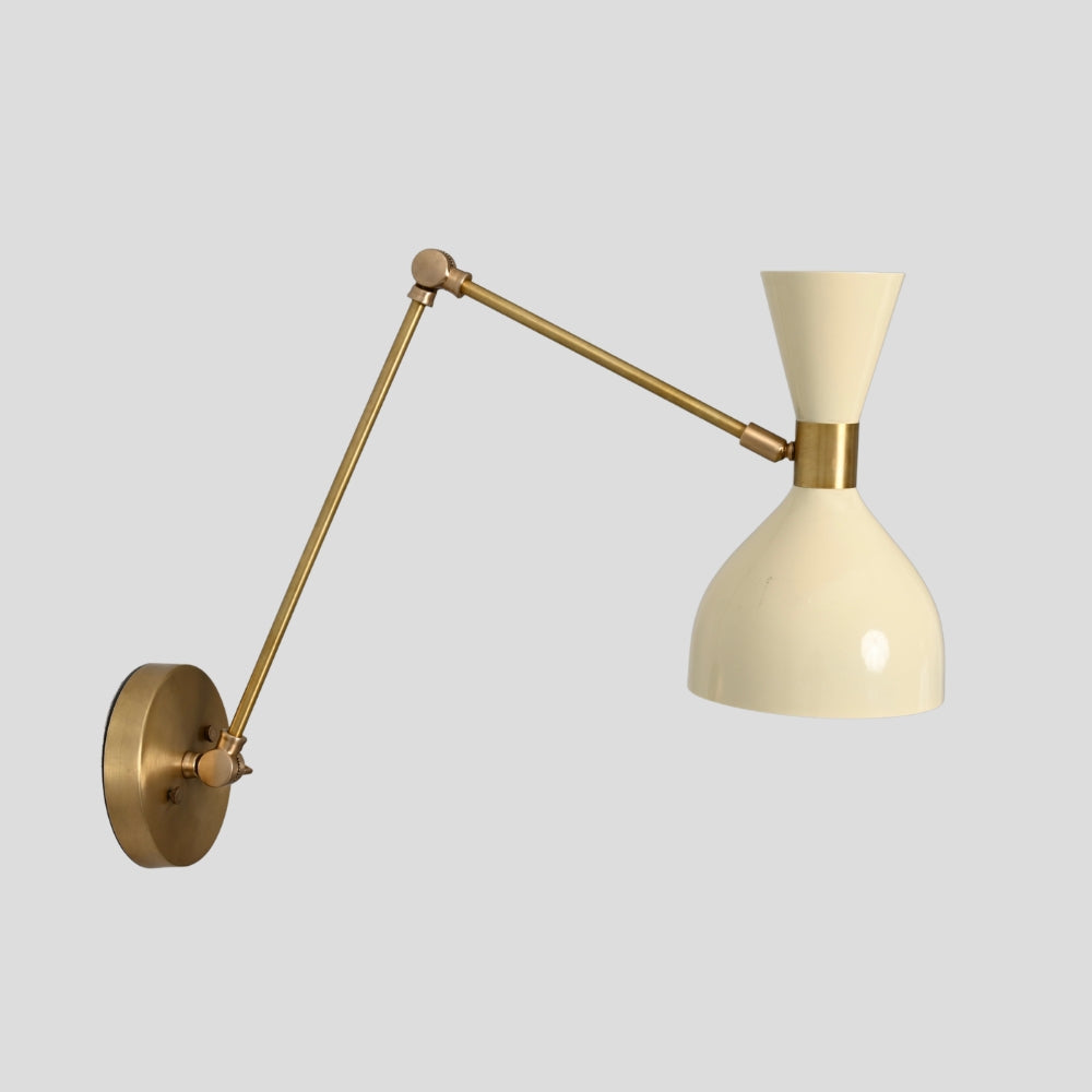 Brass swing arm wall light with adjustable joint and cream shade