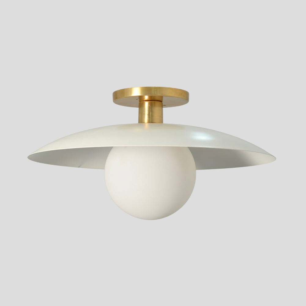 Flush mount ceiling light featuring a smooth, spherical glass globe with a matte white finish, designed for a clean and minimalist look.