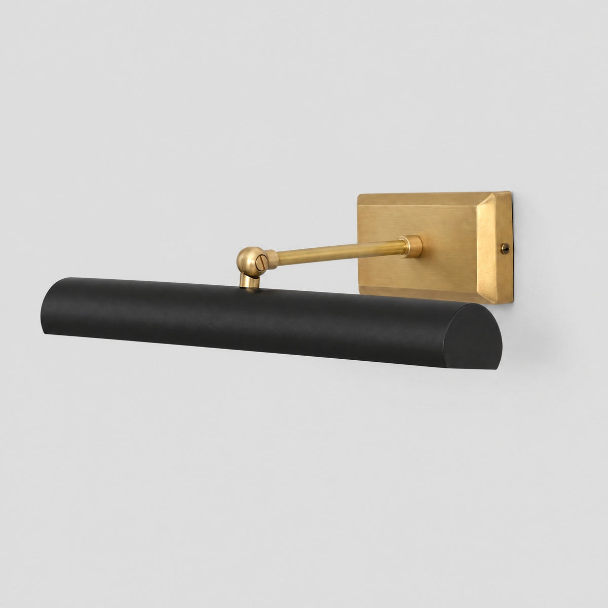 Brass picture light, three-quarter view from the left showing the swivel arm, by BrassBeam